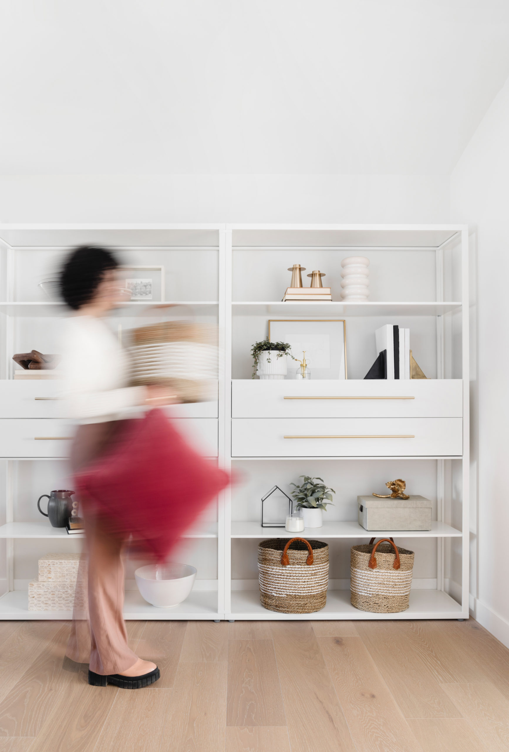 woman moving through office, blurred
