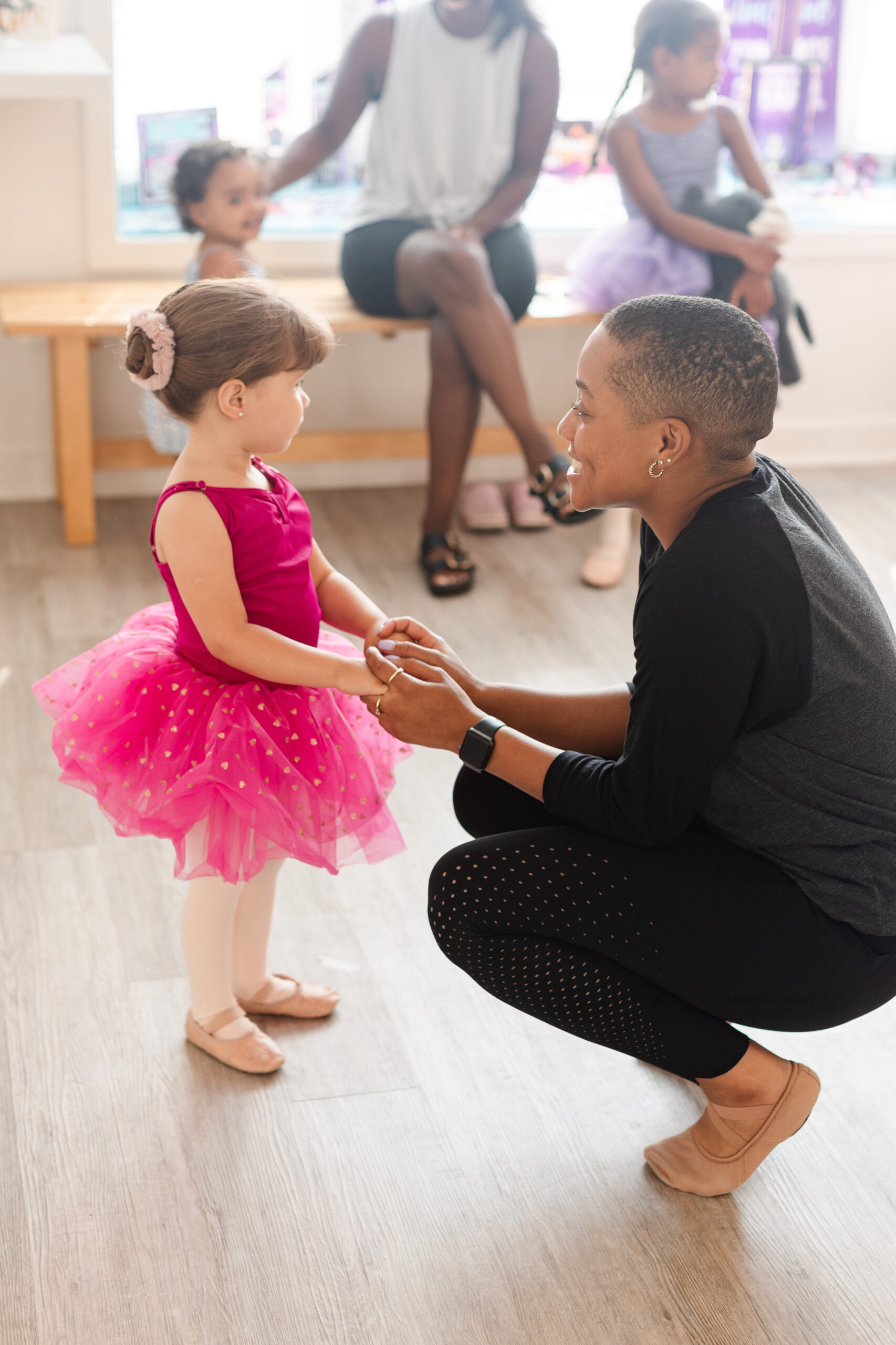 My Joie connecting with her young dance student