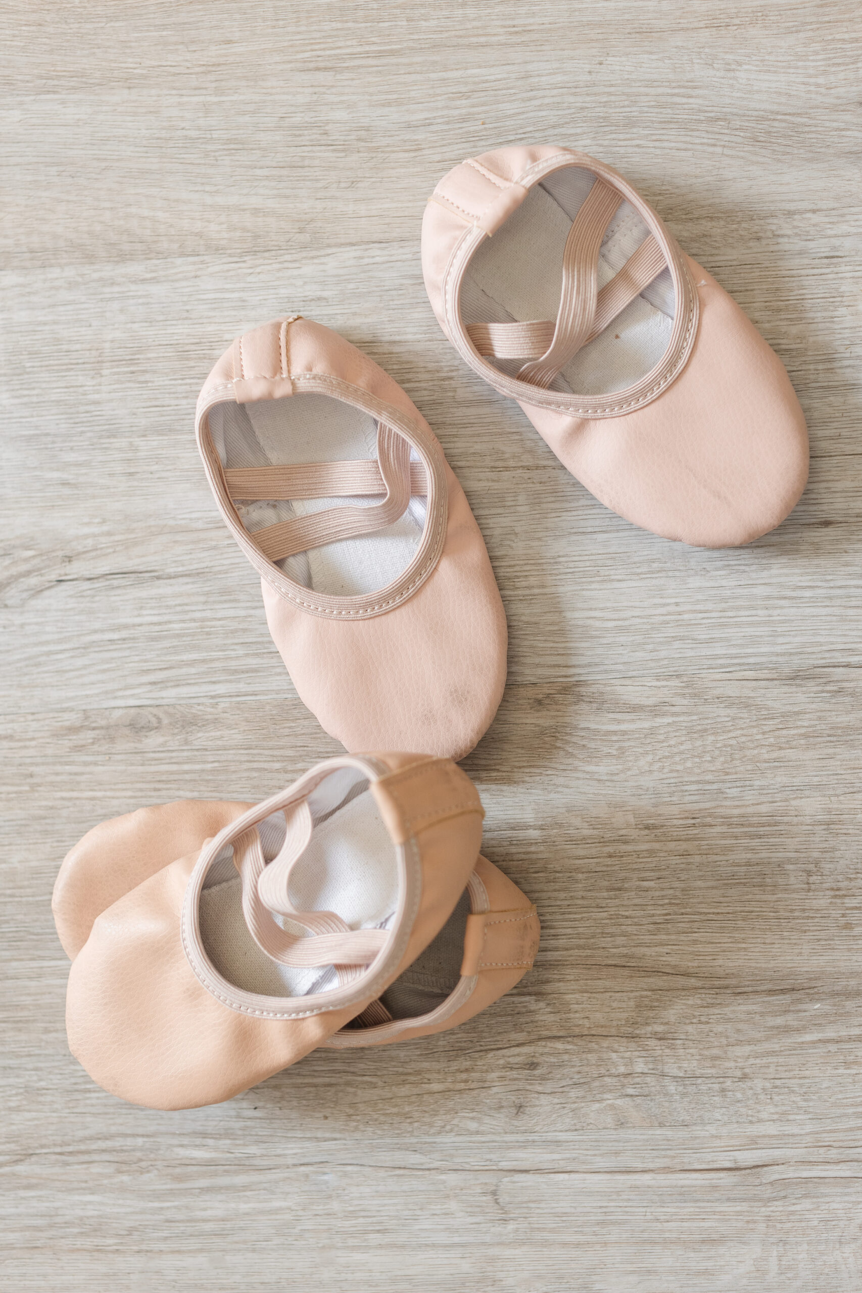 Tiny ballet shoes arranged adorably 