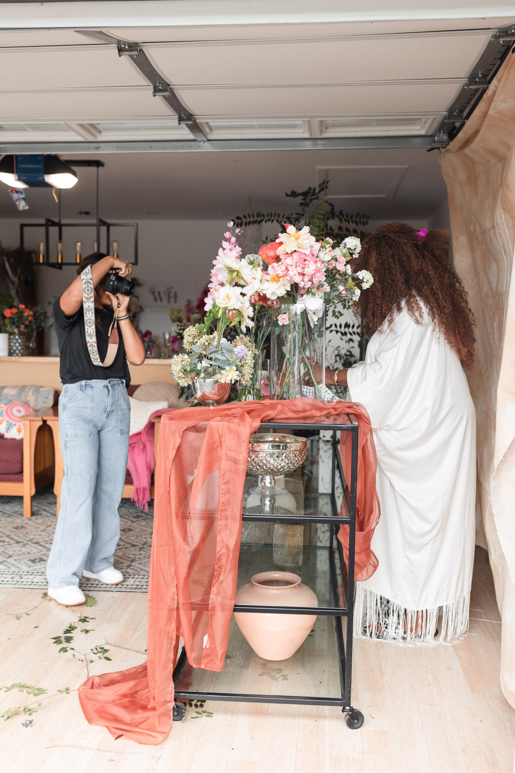 a latina photographer takes photos for a wedding florist's branding session