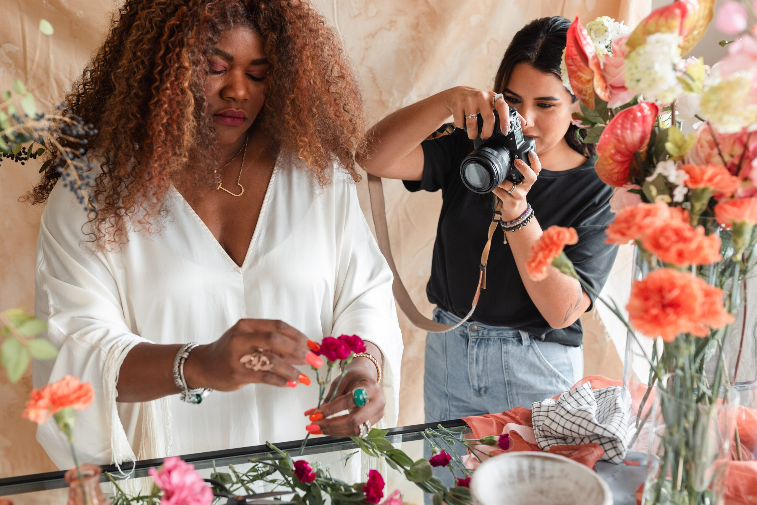 a latina photographer takes photos for a wedding florist's branding session