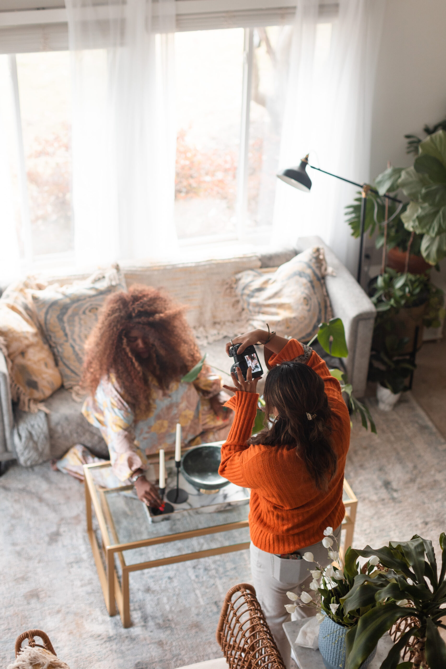 a latina photographer takes photos for an interior designer's branding session