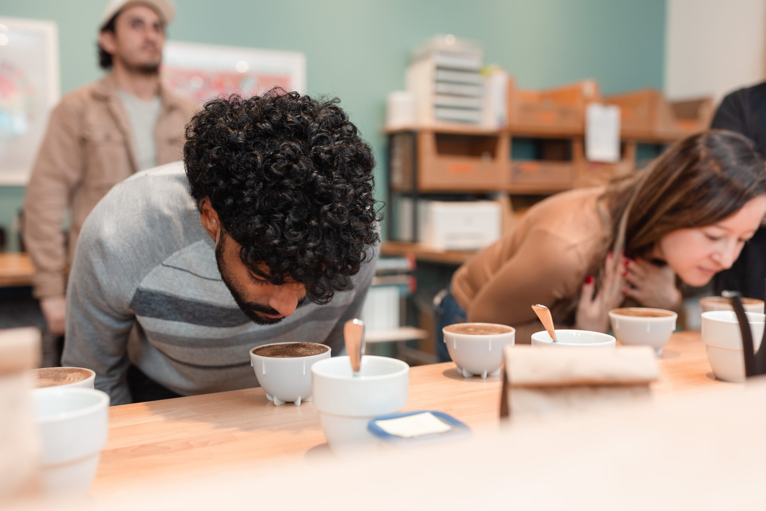 Two people smell coffee during a cupping class in Falls Church City, Virginia