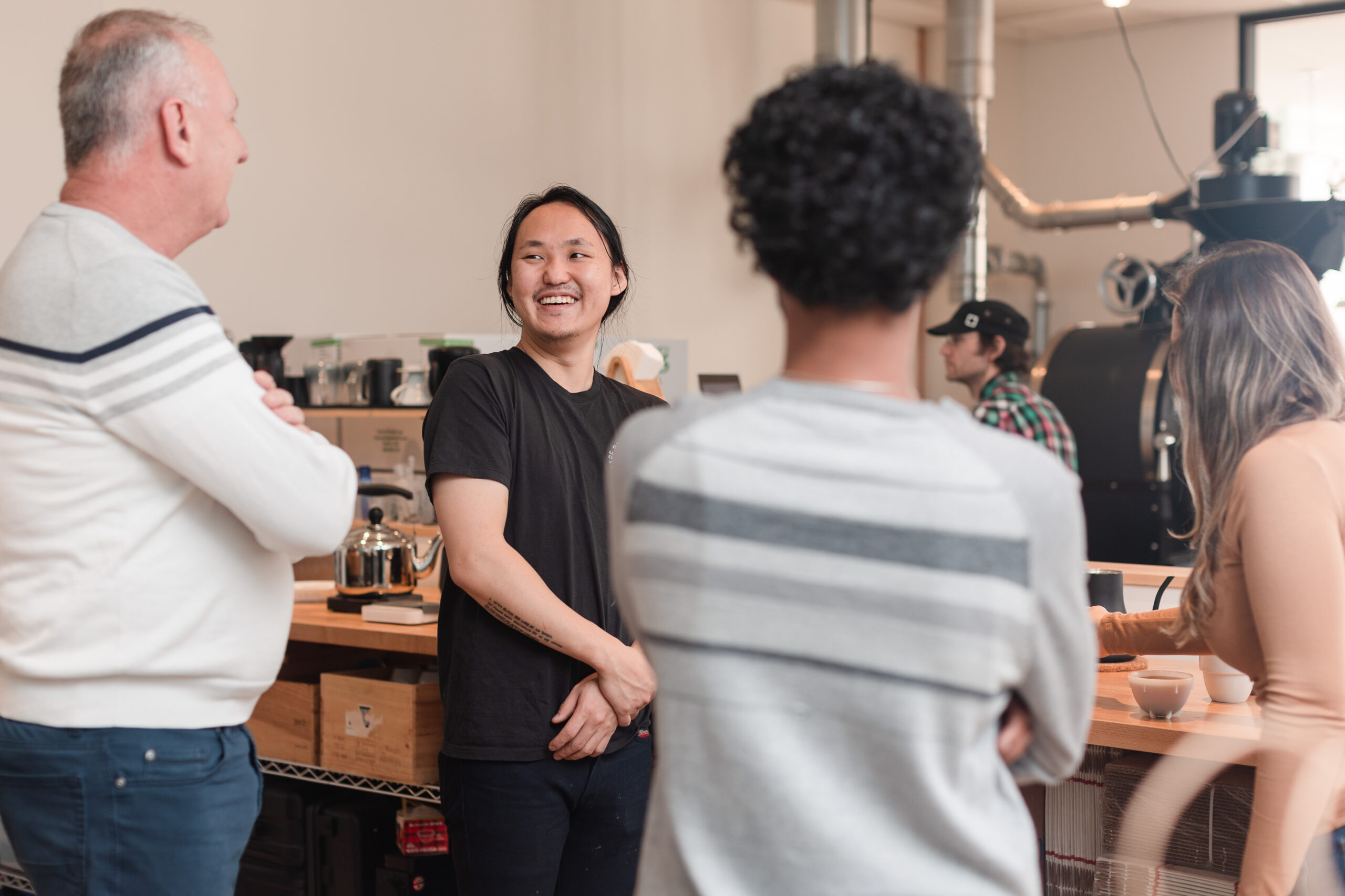 Folks chat about coffee after a cupping class