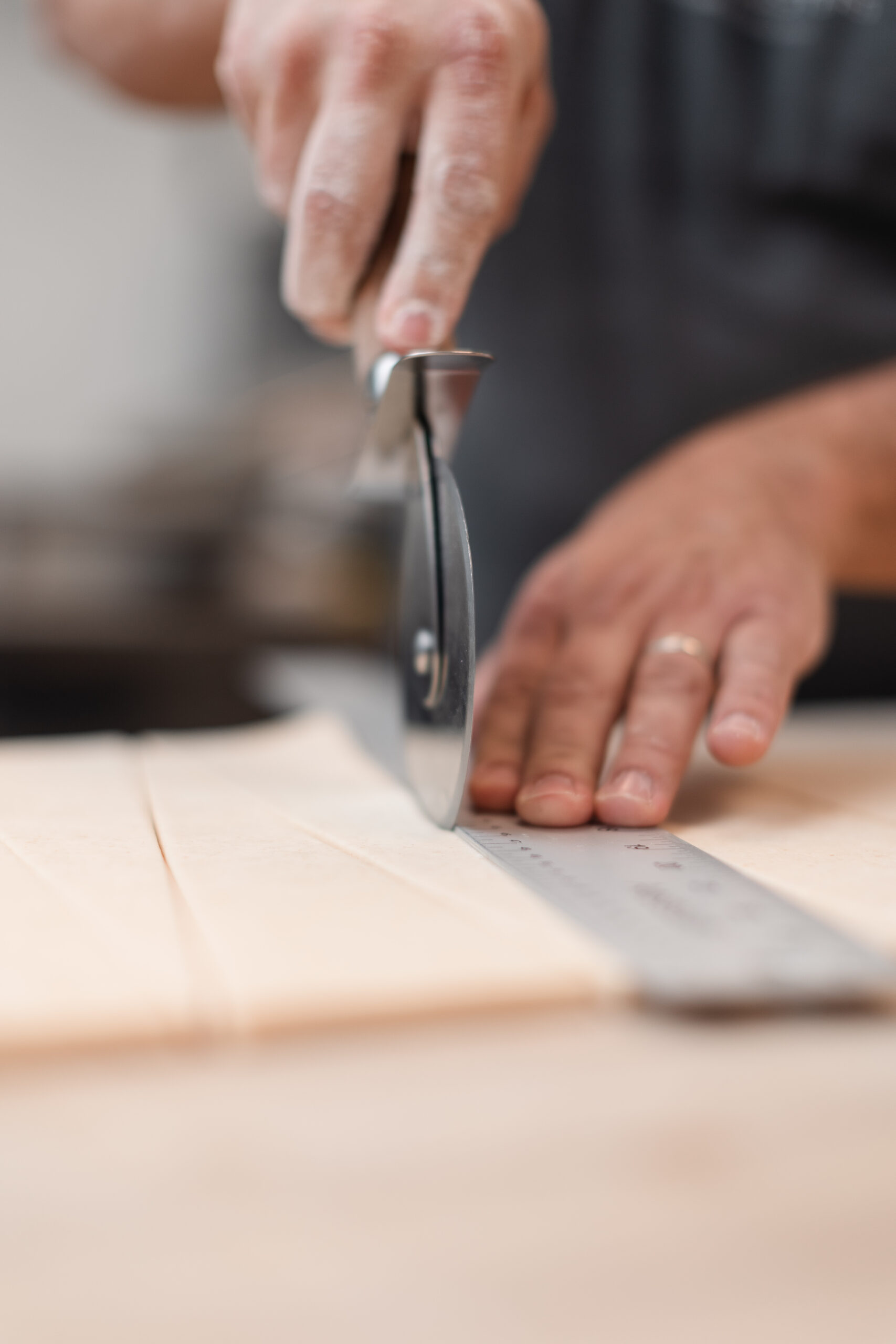 Croissant dough is carefully measured and cut at Rare Bird Coffee Roasters in Falls Church City, Virginia
