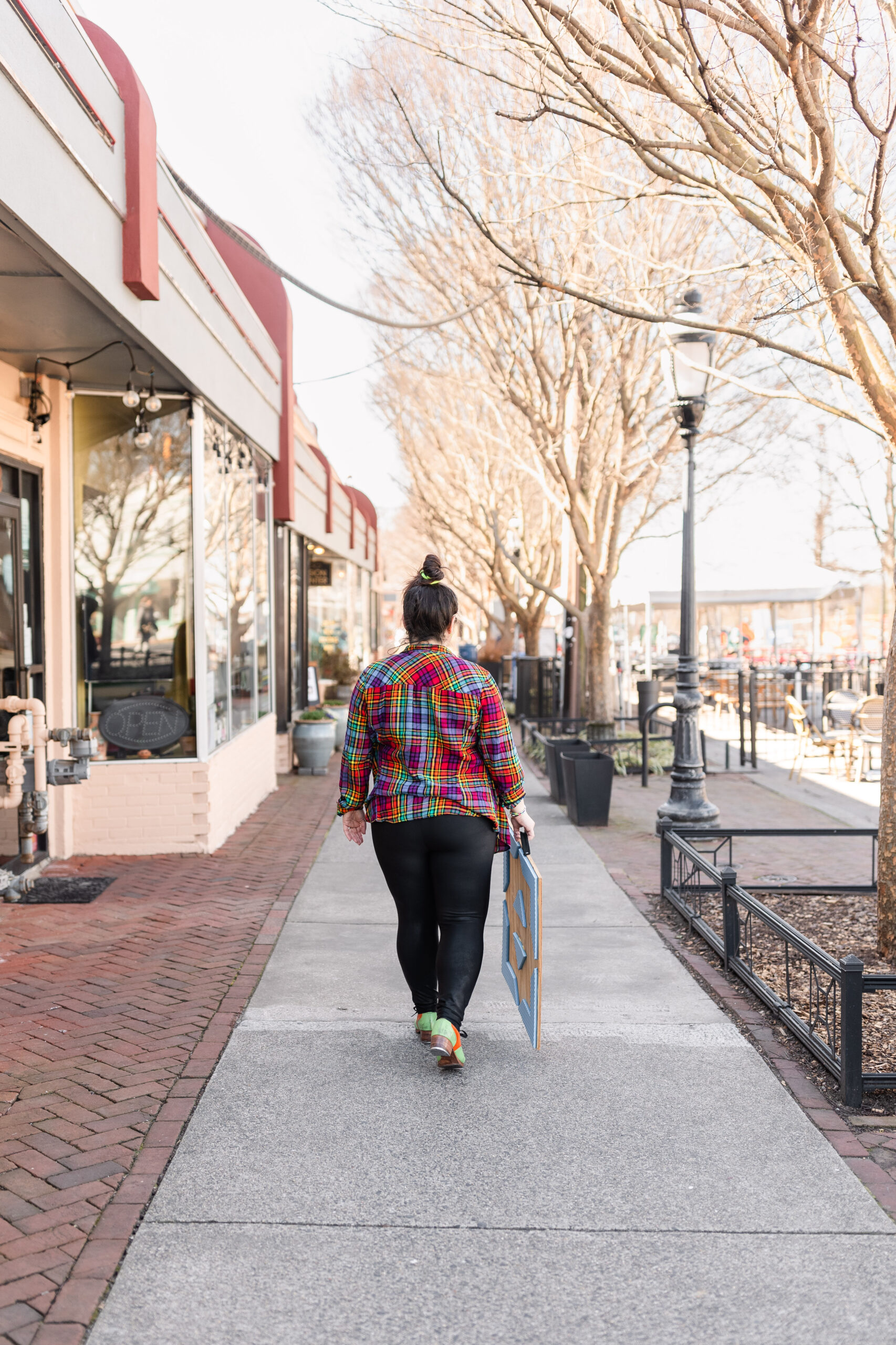 a tap dancers walks with her wooden tap floor